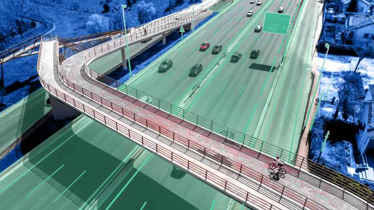 Vista aérea de uma estrada mostrando elementos urbanos, incluindo placas de sinalização, buracos no asfalto e postes de iluminação pública.